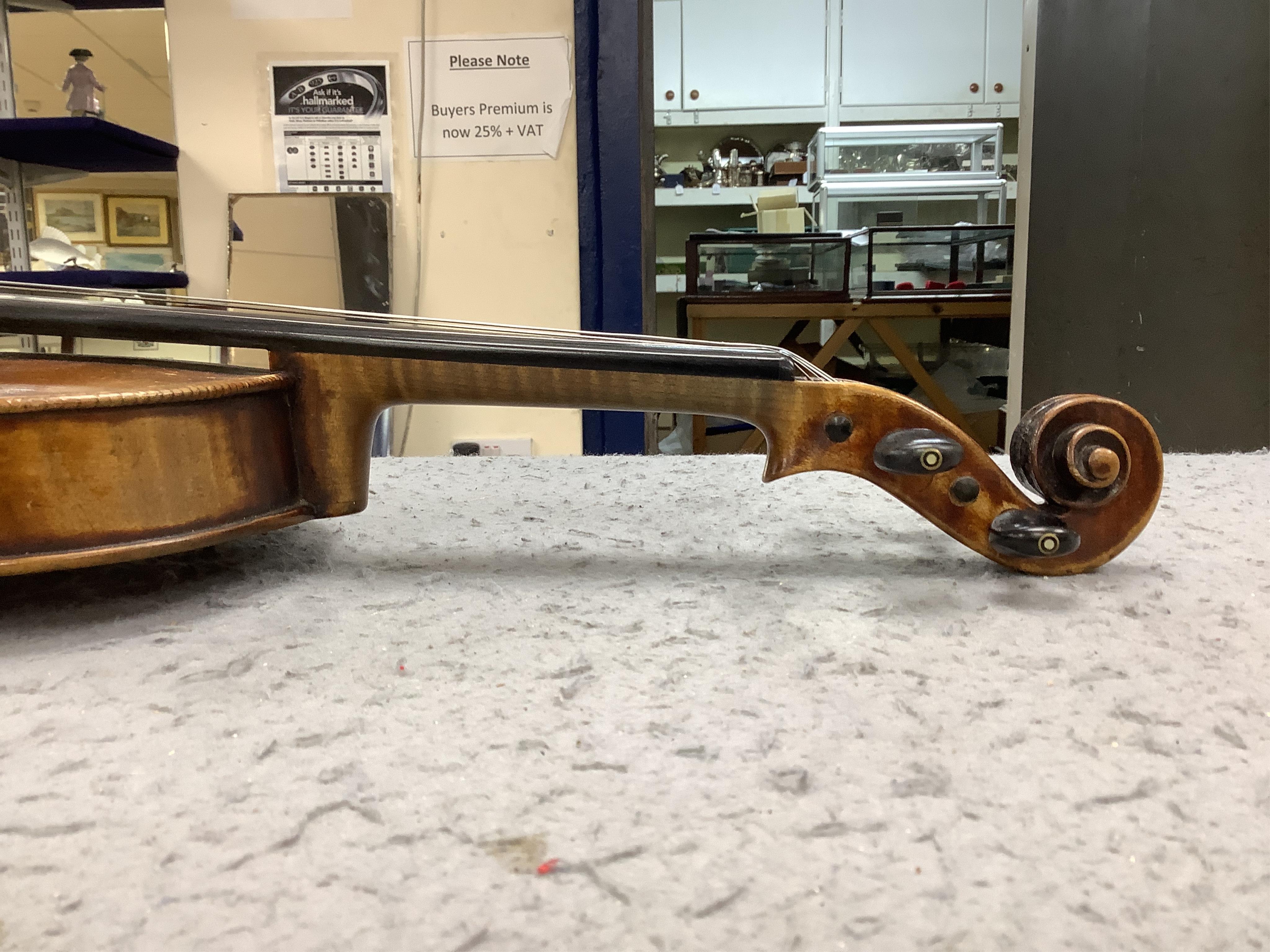 A cased 19th century English violin, with label reading George Craske, Fecit 1842, Edward Crompton, 54, Barton Arcade, Deansgate, Manchester, body length 36cm. Condition - fair to good.